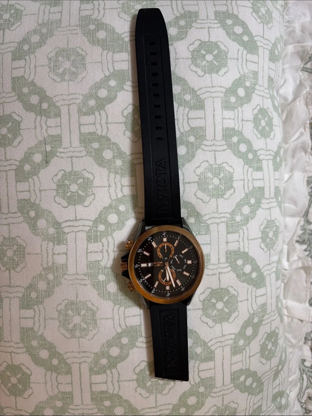 Invicta Specialty GMT watch, featuring a rose gold-tone case and a black dial.